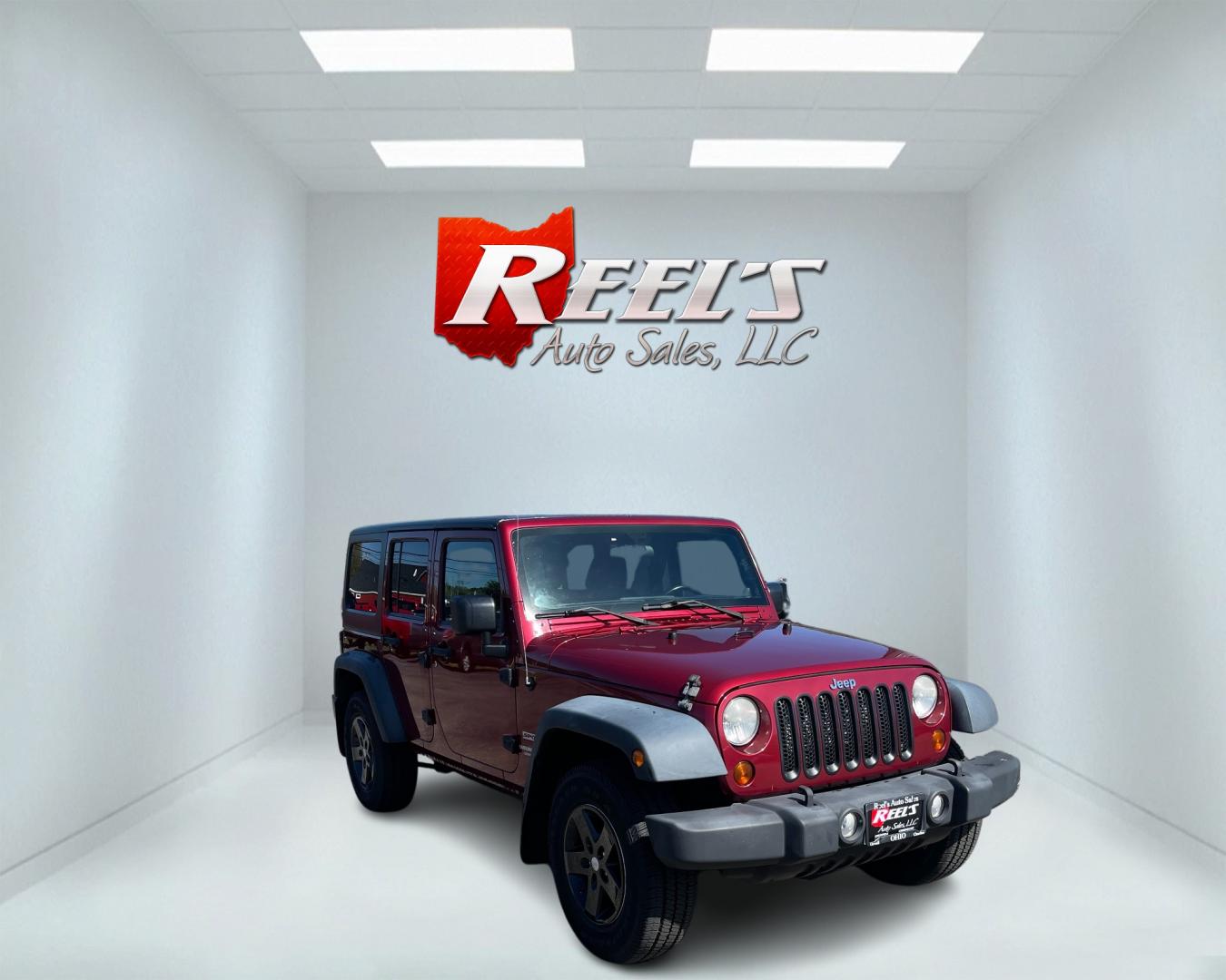 2012 Red /Black Jeep Wrangler Unlimited Sport 4WD (1C4BJWDG3CL) with an 3.6L V6 DOHC 24V engine, 5-Speed Automatic transmission, located at 547 E. Main St., Orwell, OH, 44076, (440) 437-5893, 41.535435, -80.847855 - This 2012 Jeep Wrangler Unlimited Sport with 4WD features a robust 3.6-liter Pentastar V6 engine paired with a 5-speed automatic transmission. It is equipped with a Dana 44 rear axle and a Dana 30 front axle, ensuring durable and reliable off-road capabilities. The model comes with a hardtop convert - Photo#2